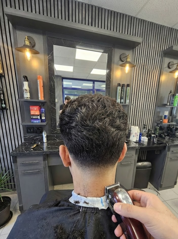 Professional barber cutting hair with precision